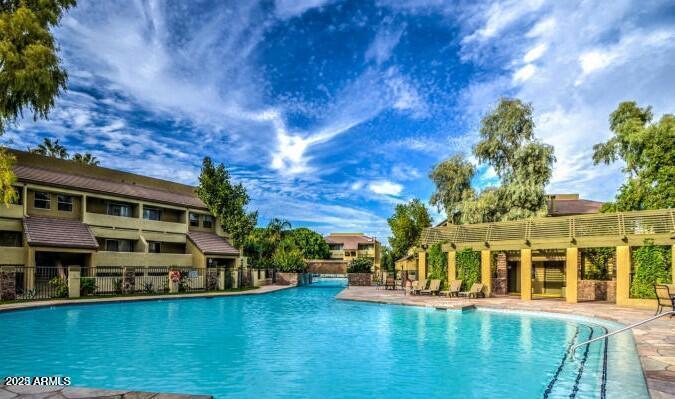 1331 West Baseline Road, Unit 241 Mesa, AZ 85202 - Photo 11 of 11 a view of a house with pool and a yard