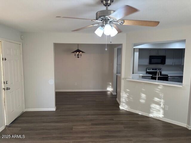 1331 West Baseline Road, Unit 241 Mesa, AZ 85202 - Photo 3 of 11 a view of a kitchen with a sink a refrigerator a ceiling fan and wooden floor