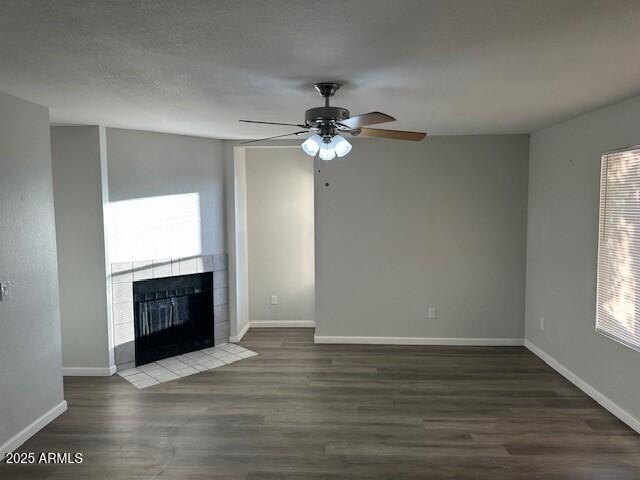 1331 West Baseline Road, Unit 241 Mesa, AZ 85202 - Photo 4 of 11 an empty room with wooden floor chandelier fan and windows