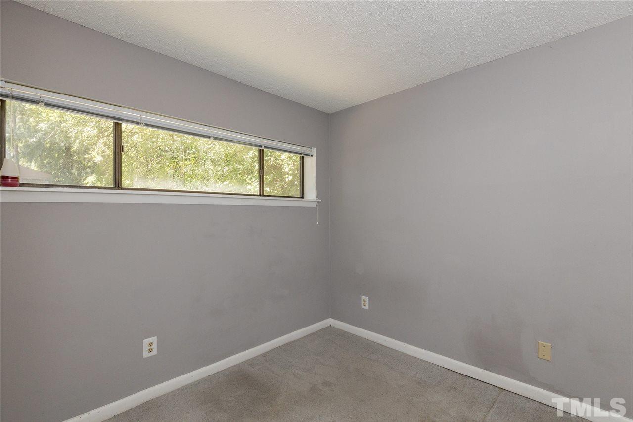 611 Pine Ridge Place, Unit 611 Raleigh, NC 27609 - Photo 14 of 26 an empty room with a window