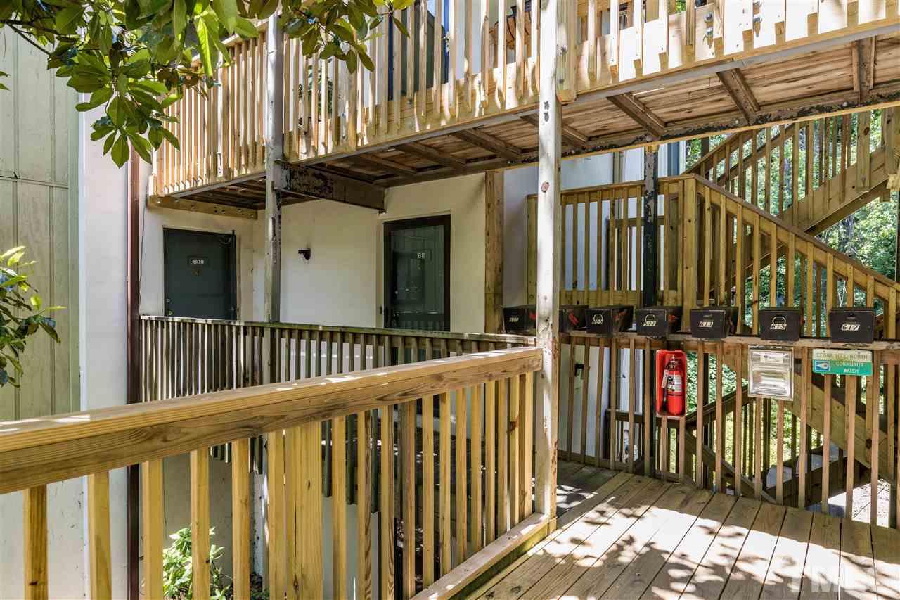 611 Pine Ridge Place, Unit 611 Raleigh, NC 27609 - Photo 4 of 26 a view of a house with wooden fence