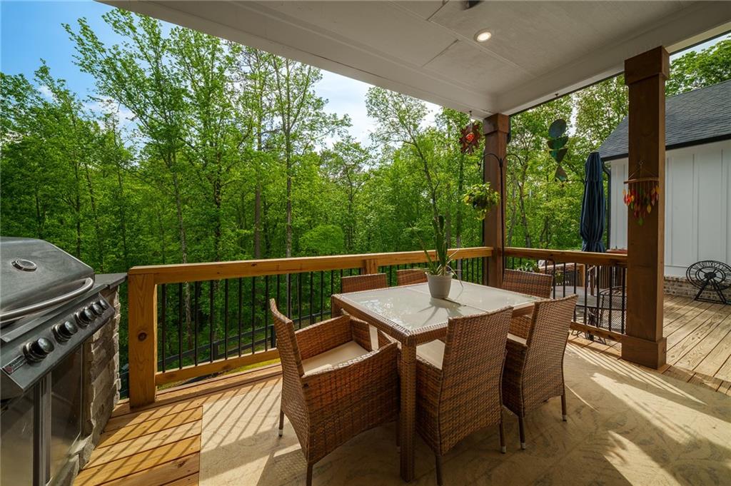 392 London Road Ball Ground, GA 30107 - Photo 25 of 53 a view of a chairs and table in the balcony
