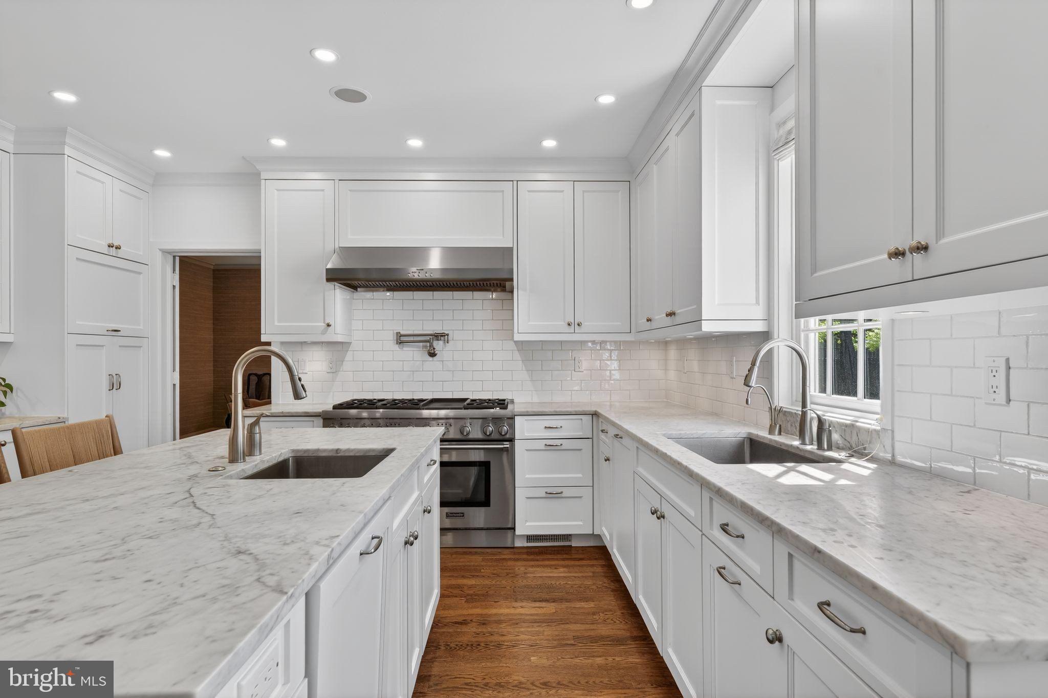 4340 Garfield Street Northwest Washington, DC 20007 - Photo 11 of 42 a large kitchen with stainless steel appliances granite countertop a sink and cabinets
