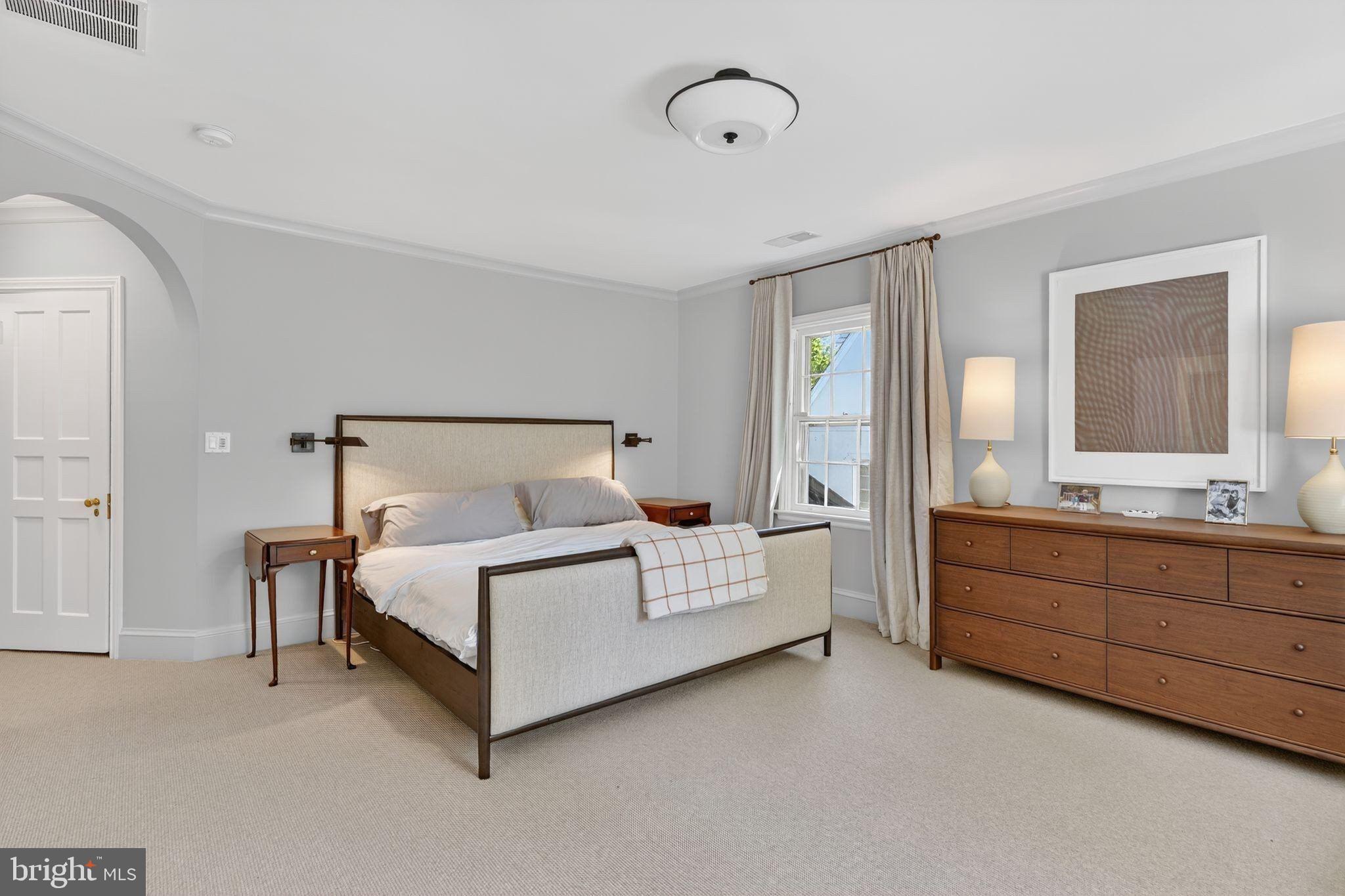 4340 Garfield Street Northwest Washington, DC 20007 - Photo 23 of 42 a spacious bedroom with a bed and a dresser