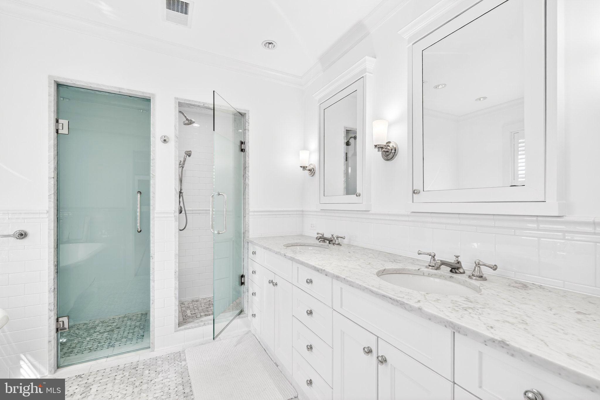 4340 Garfield Street Northwest Washington, DC 20007 - Photo 24 of 42 a bathroom with a granite countertop sink mirror and double