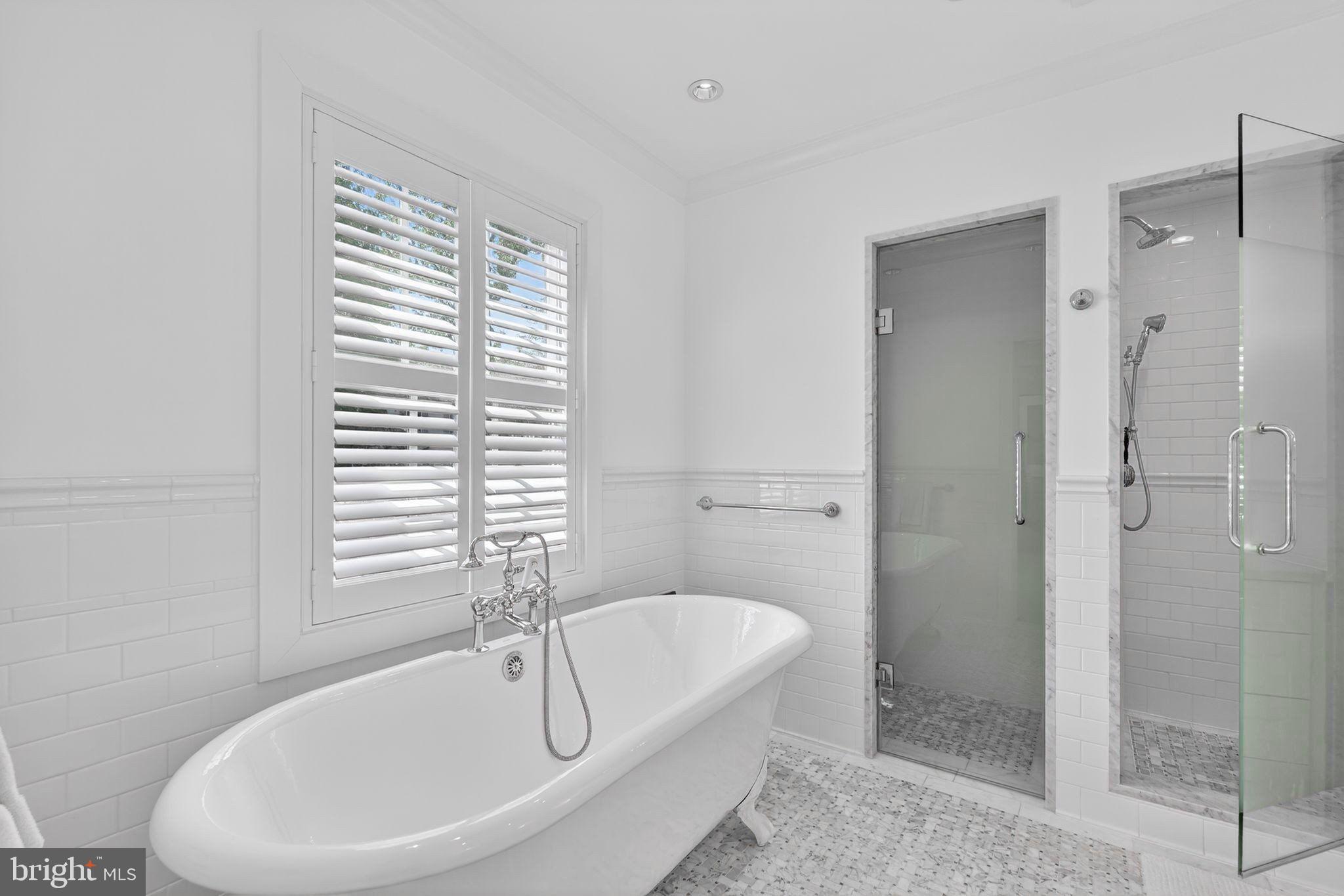 4340 Garfield Street Northwest Washington, DC 20007 - Photo 25 of 42 a bathroom with a bathtub and a shower