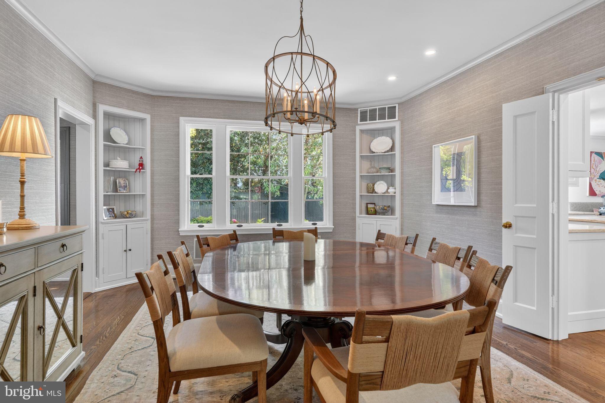 4340 Garfield Street Northwest Washington, DC 20007 - Photo 7 of 42 a dining room with furniture a chandelier and wooden floor