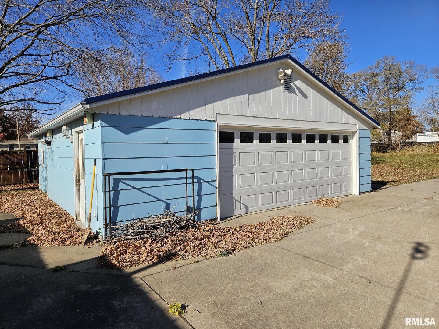 313 East 3rd Street Wilton, IA 52778 - Photo 3 of 14 a view of a white house with a large space