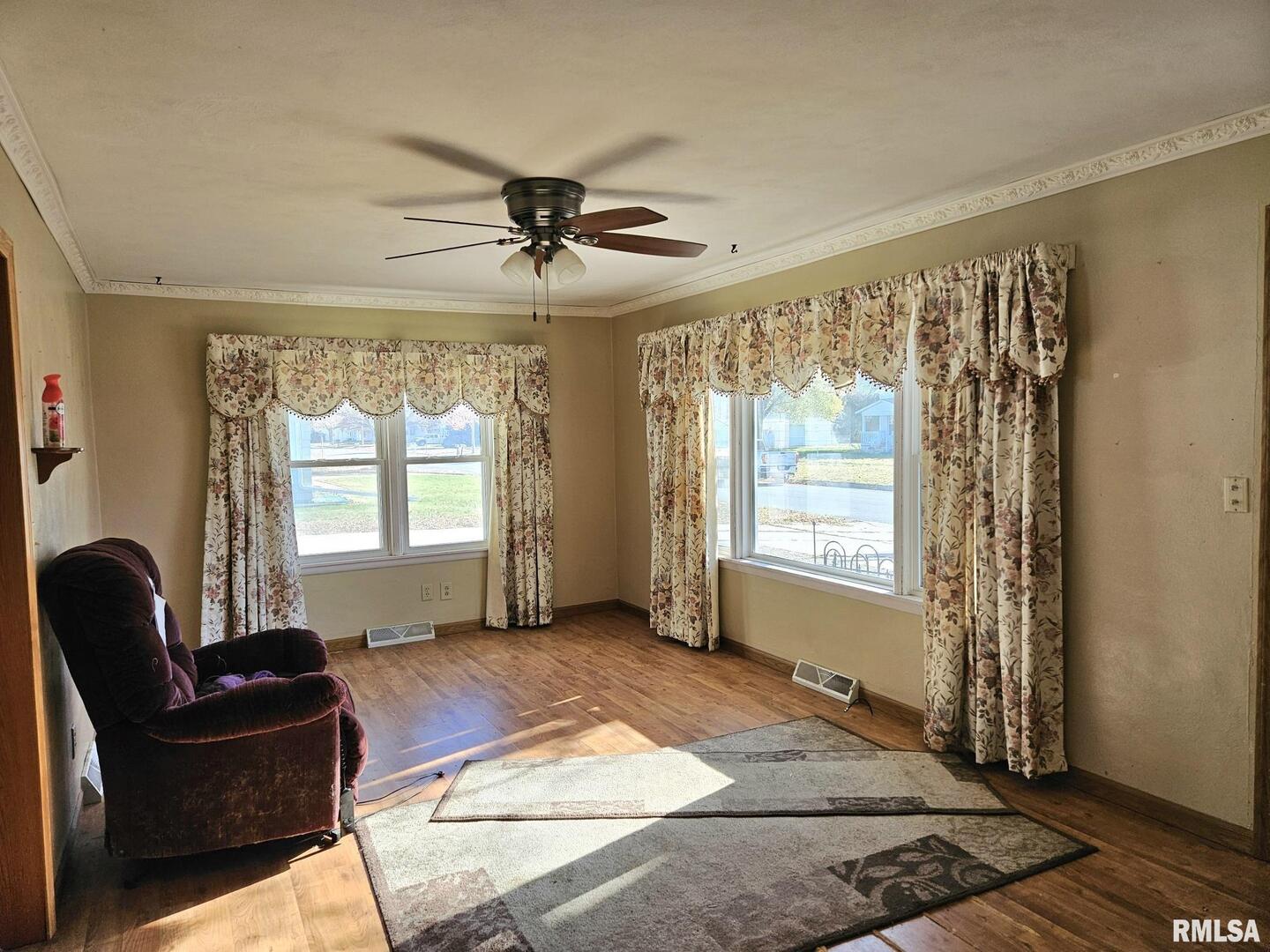 313 East 3rd Street Wilton, IA 52778 - Photo 9 of 14 a living room with furniture and a window