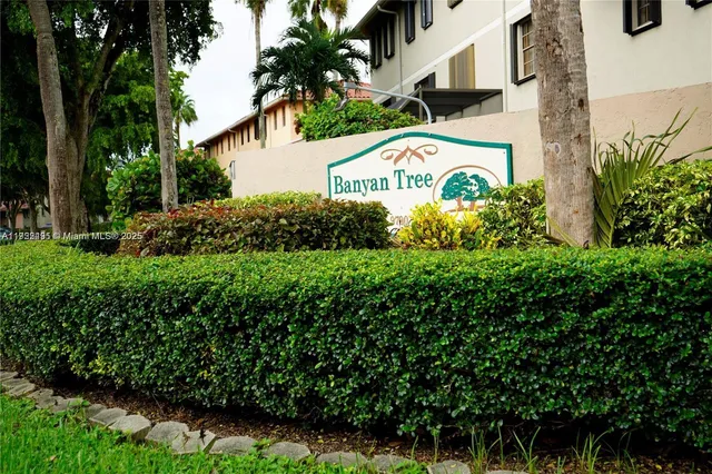 a view of sign board and green space