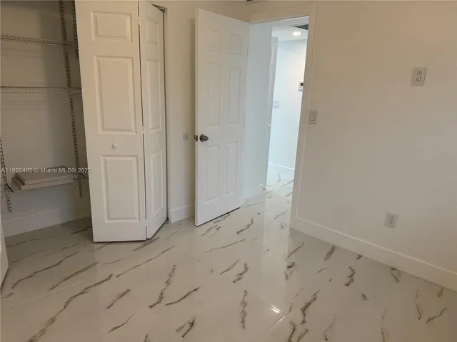 an empty room with white door