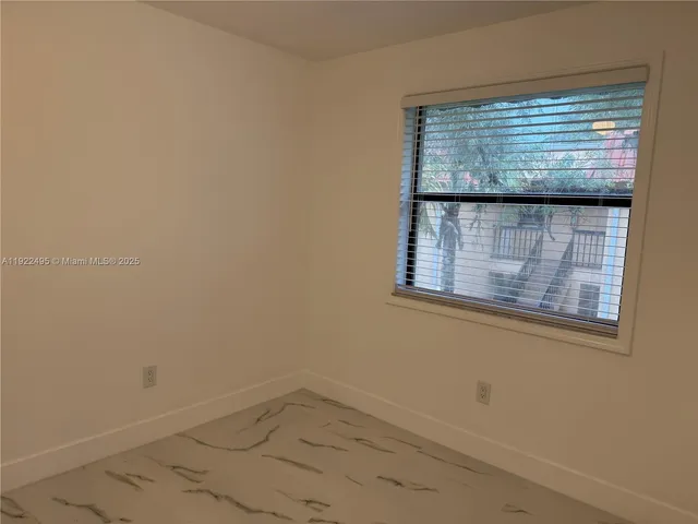 a bathroom with a shower and a toilet