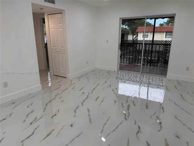 an empty room with sliding door