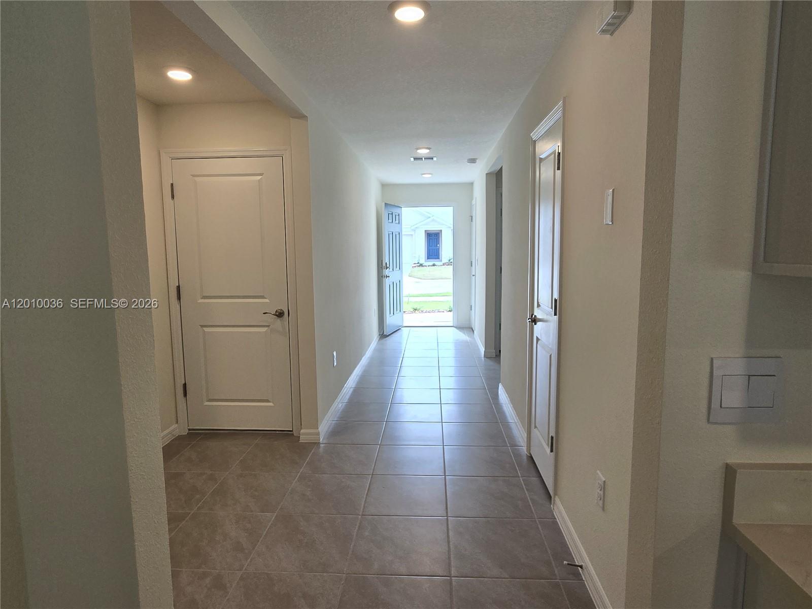 9871 Southeast 161st Lane Road Summerfield, FL 34491 - Photo 7 of 31 a view of a hallway with wooden shelves