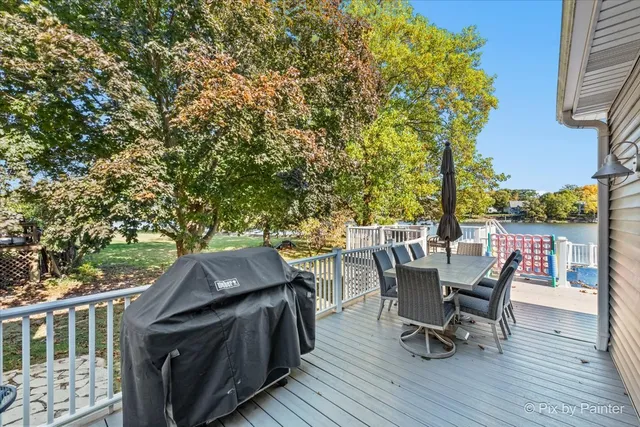 a view of a chairs and table on the deck