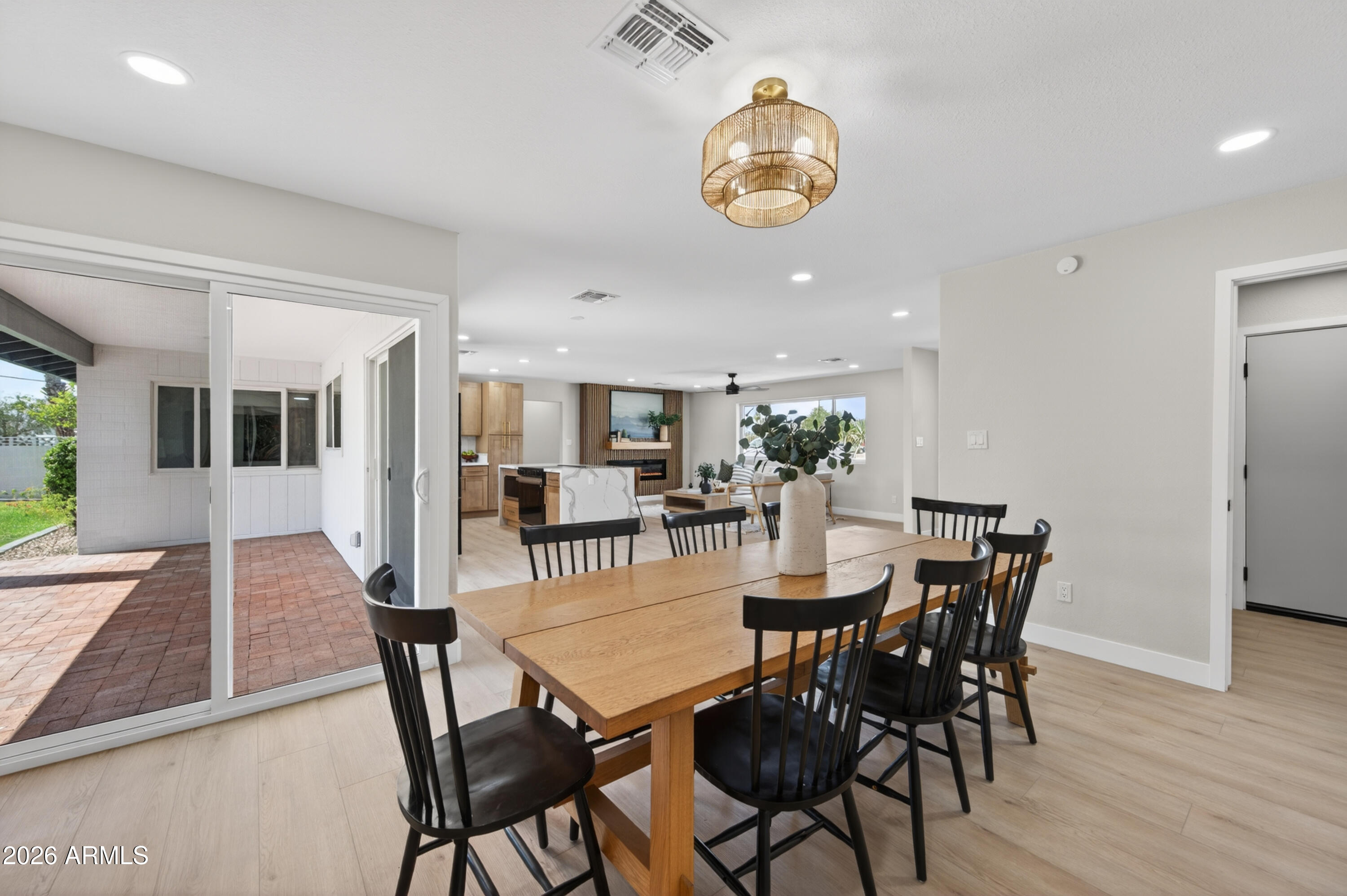 3422 South Terrace Road Tempe, AZ 85282 - Photo 14 of 43 a view of a dining room with furniture and wooden floor