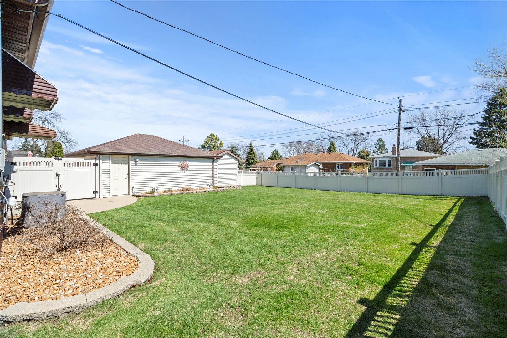 11007 Major Avenue Chicago Ridge, IL 60415 - Photo 4 of 21 a view of a house with a backyard and a patio