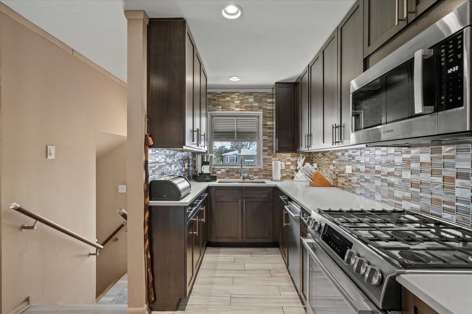 11007 Major Avenue Chicago Ridge, IL 60415 - Photo 10 of 21 a kitchen with stainless steel appliances granite countertop a stove a sink dishwasher and a refrigerator