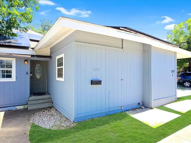 a view of a backyard with potted plants