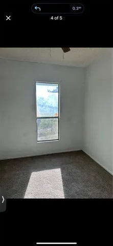 a view of open kitchen with cabinets