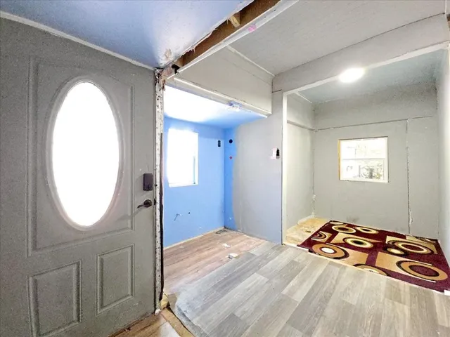 a bedroom with a bed and a mirror