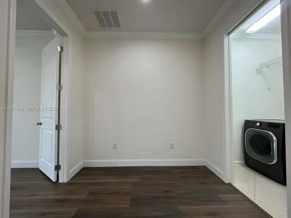 a view of a storage & utility room with wooden floor