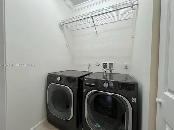 a utility room with dryer and washer