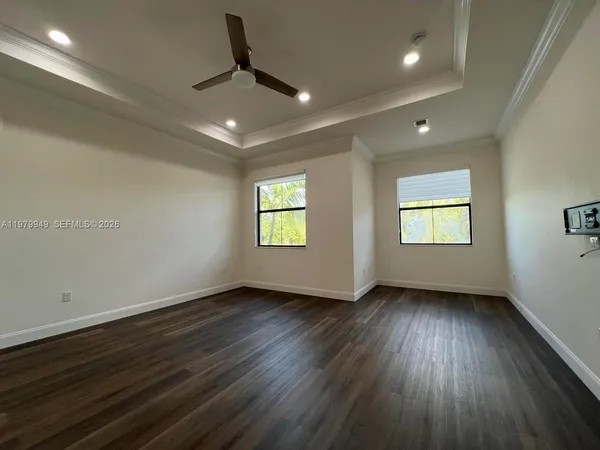 a view of room with window and hardwood floor