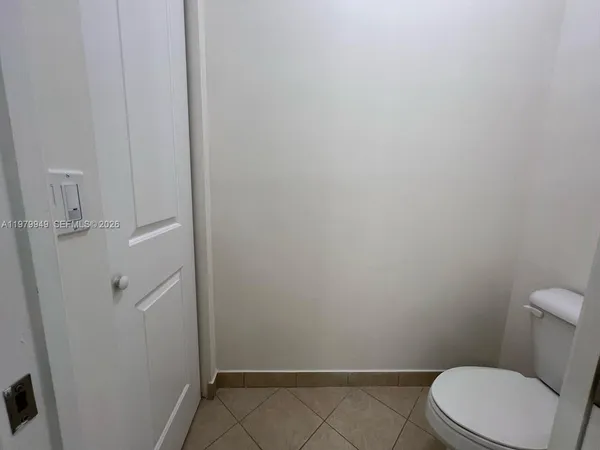 a bathroom with a tub a sink double vanity and a mirror