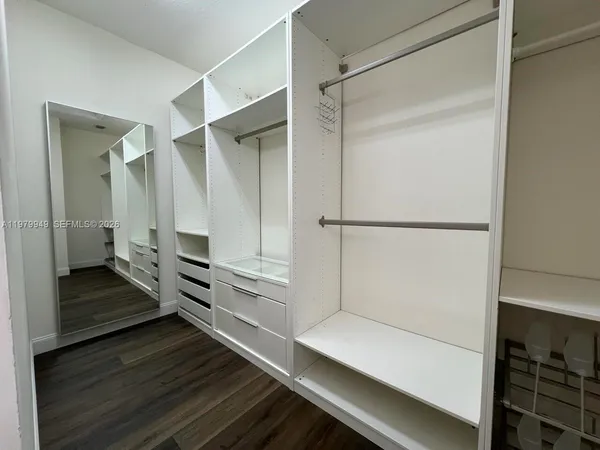 a bathroom with a sink a double vanity and a mirror
