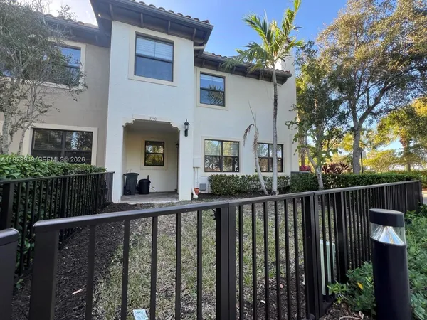 a view of a house with a small yard