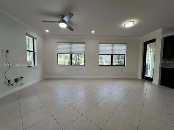 a view of an empty room with a window