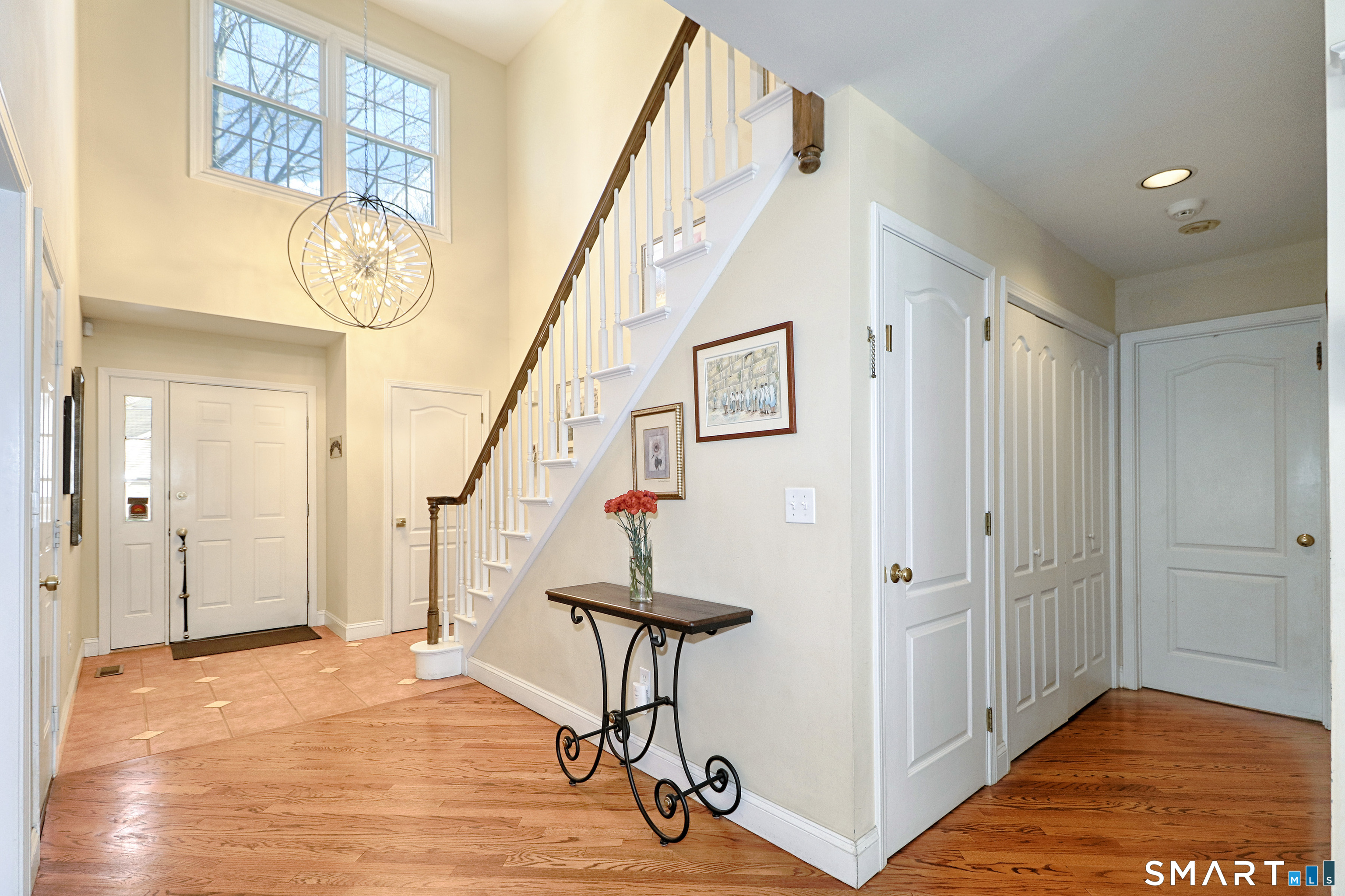 415 Pitkin Hollow, Unit 415 Trumbull, CT 06611 - Photo 4 of 35 2 story foyer with new chandelier