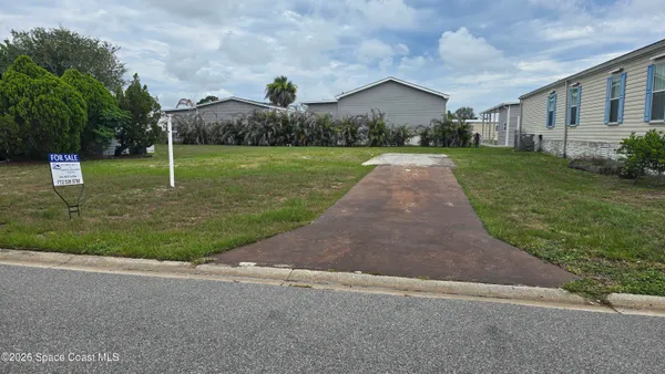 $58,000 | 855 Hawthorn Circle, Barefoot Bay, FL 32976