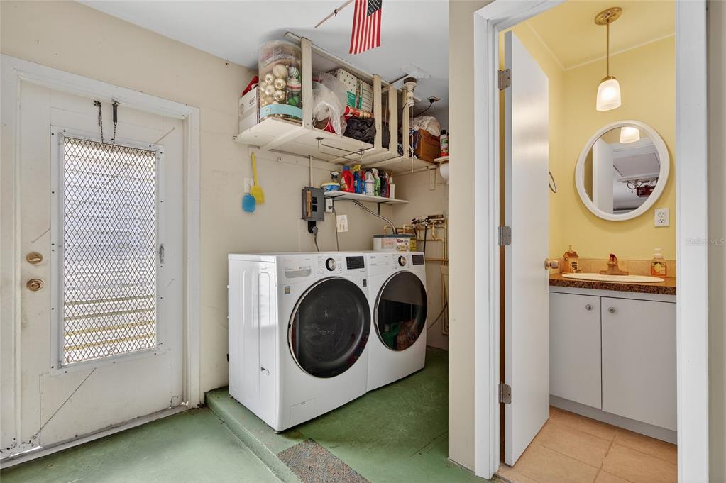 9238 140th Lane Seminole, FL 33776 - Photo 25 of 36 a utility room with sink dryer and washer