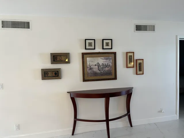 a view of a workspace with furniture