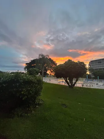 a view of a lake with a yard