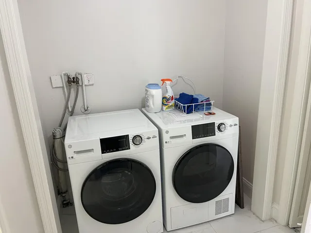 a utility room with dryer and washer