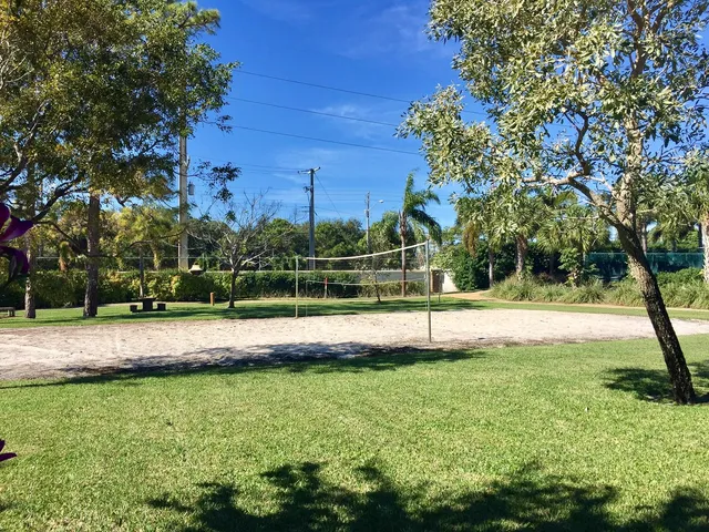 a view of a lake with houses in the back