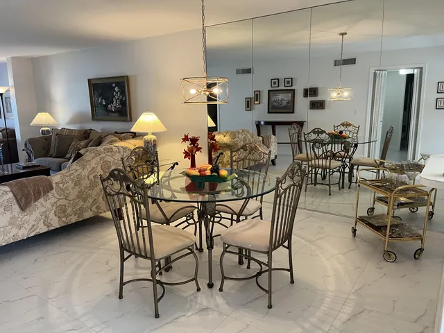 a very nice looking dining room with furniture