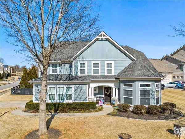 a front view of a house with a yard