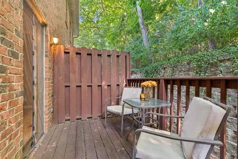 a balcony view with a seating space