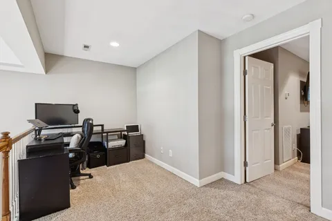 a view of a hallway with staircase