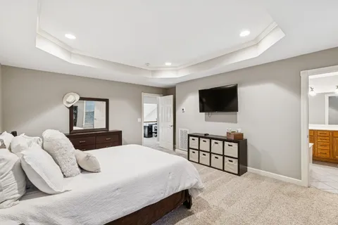 a bathroom with a double vanity sink mirror and toilet