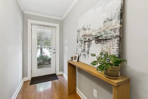 a room with water heater and wooden floor