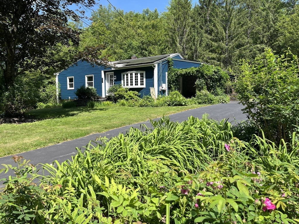 947 Burts Pit Road Northampton, MA 01062 - Photo 3 of 42 a front view of a house with a yard