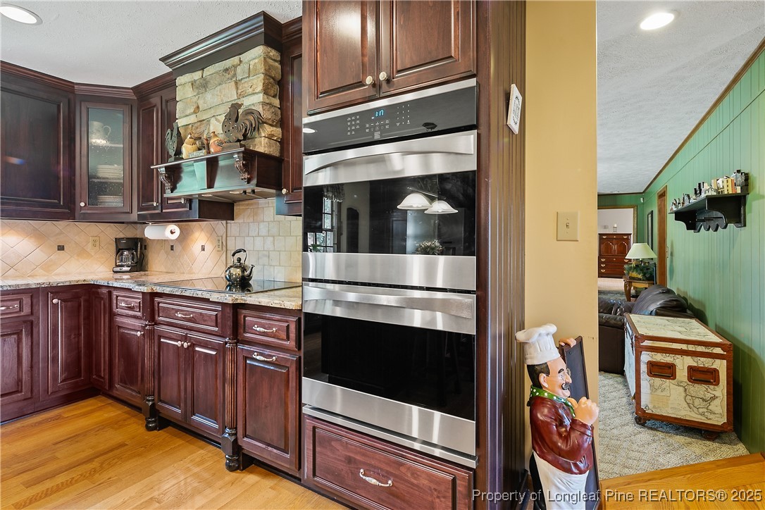 5017 Goldsboro Road Wade, NC 28395 - Photo 11 of 50 a kitchen with stainless steel appliances and cabinets