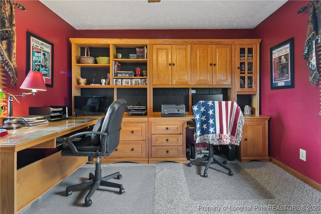 5017 Goldsboro Road Wade, NC 28395 - Photo 18 of 50 a view of a workspace with furniture and a window