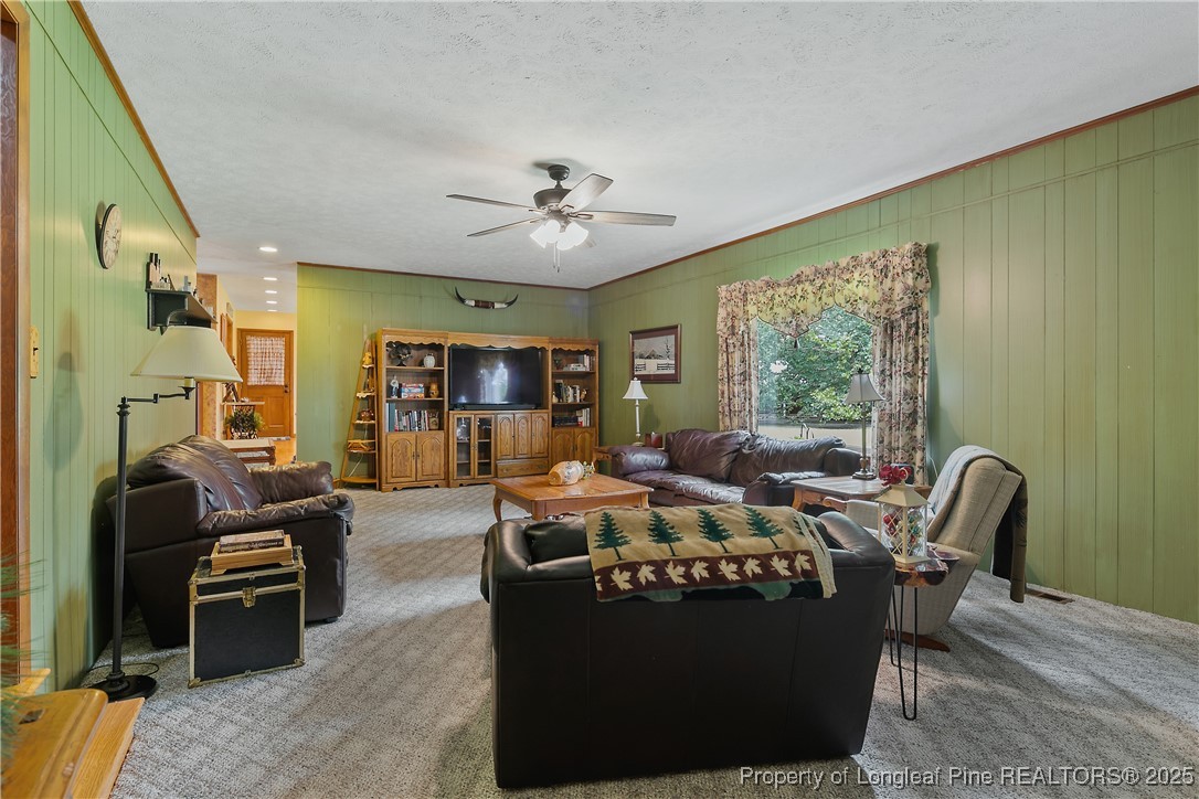 5017 Goldsboro Road Wade, NC 28395 - Photo 23 of 50 a living room with furniture large window and chairs