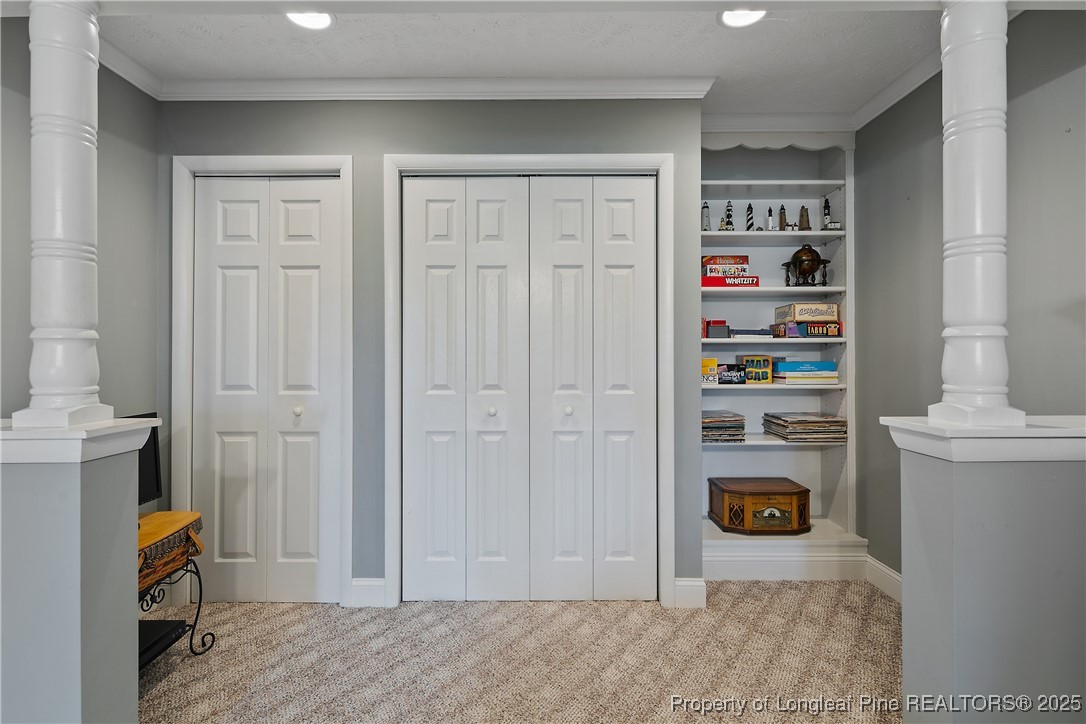 5017 Goldsboro Road Wade, NC 28395 - Photo 27 of 50 a view of walk in closet with clothes and shoes